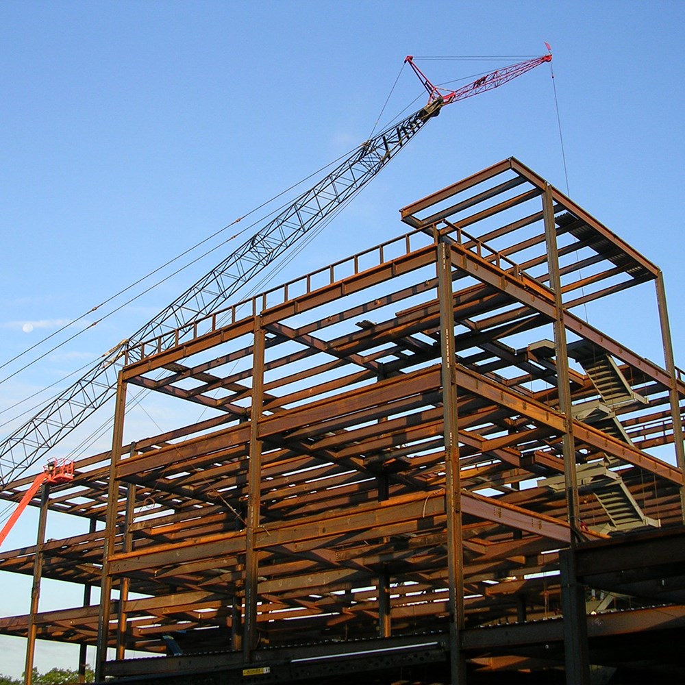 A crane lifts steel beams during the construction of St. Vincent Mercy Medical Center Heart Pavilion.